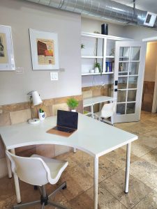 Private office showing two desks with chairs.